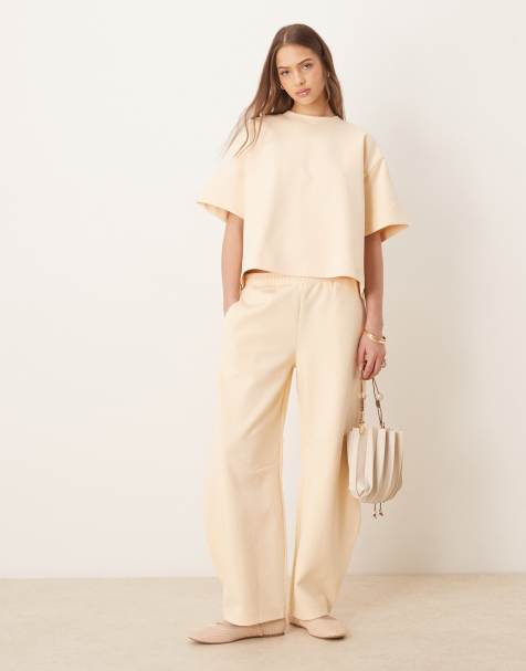 ASOS DESIGN - Joggingbroek met wijde ronde pijpen en interlock-naden in lichtgeel, deel van co-ord set - view 1