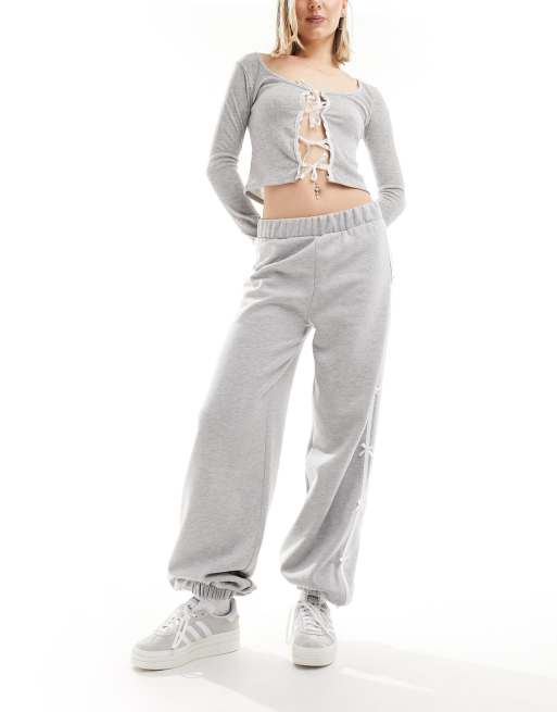 ASOS DESIGN - Joggingbroek met zijstreep en strikjes in gemêleerd grijs, 2 van 5
