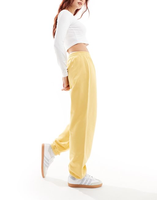 ASOS DESIGN - Joggingbroek van sweatstof met aansluitende boorden in geel
