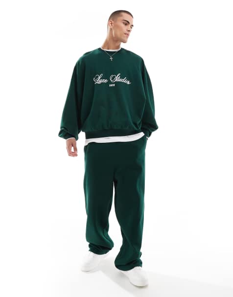 ASOS DESIGN – Jogginghose in Dunkelgrün mit weitem Bein und seitlichem Zierstreifen - view 1