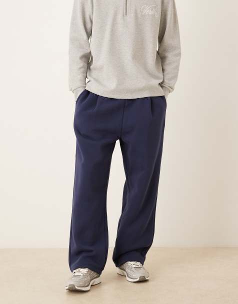 ASOS DESIGN – Jogginghose in Marineblau mit weitem Bein und Bundfalten - view 1