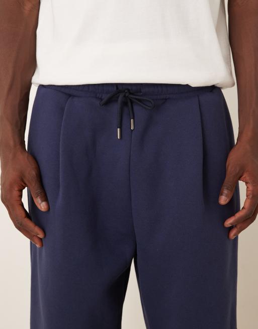 ASOS DESIGN – Jogginghose in Marineblau mit weitem Bein und Bundfalten, 4 von 5