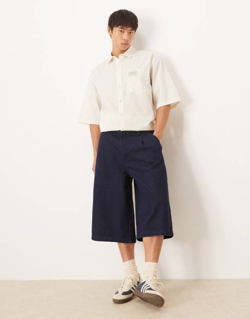 ASOS DESIGN - Jorts taglio lungo in denim lavaggio grezzo a pieghe