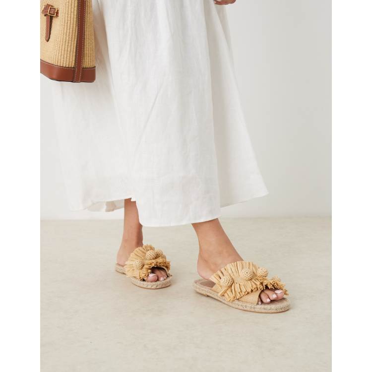 ASOS DESIGN Jovie raffia pom pom espadrille mules in natural