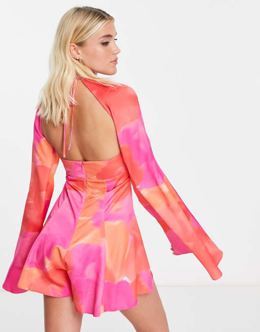 ASOS DESIGN - Jumpsuit met gerimpelde halternek, uitsnijdingen en uitlopende mouwen in carnival bloemenprint 