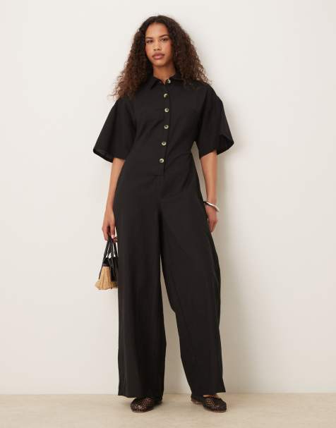 ASOS DESIGN - Jumpsuit met wijde pijpen, knopen en een kraag in zwart - view 1