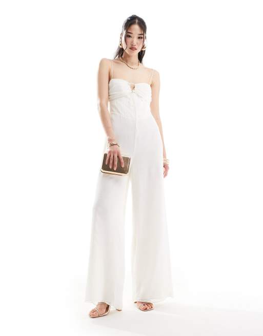 ASOS DESIGN - Jumpsuit van chiffon met wijde pijpen, gestrikte voorkant en korsetdetail in ivoorwit