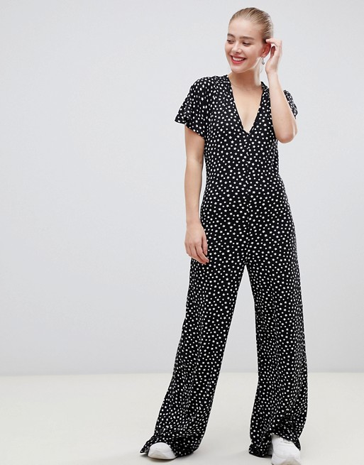 ASOS DESIGN jumpsuit with flutter sleeve and tie back in star print | ASOS
