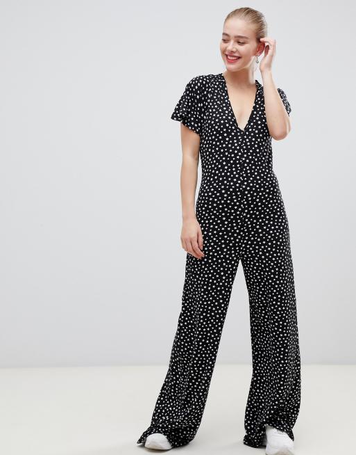 ASOS DESIGN jumpsuit with flutter sleeve and tie back in star print | ASOS