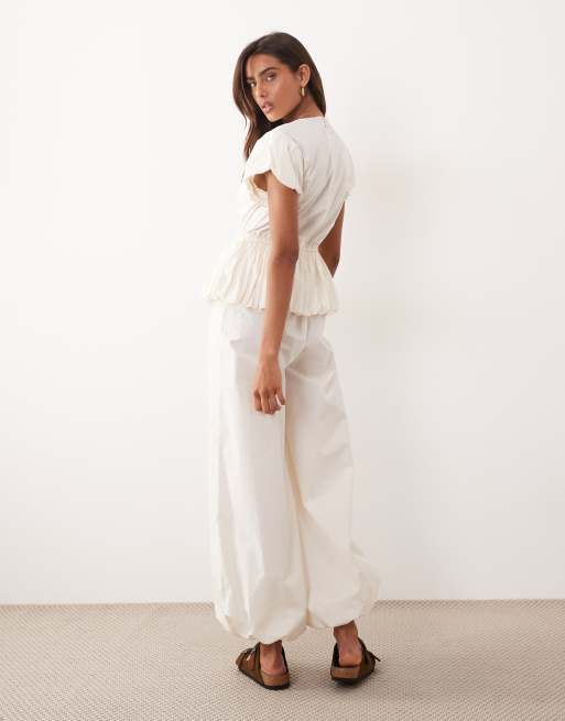 ASOS DESIGN jumpsuit with peplum and balloon legs in cream, 4 of 4