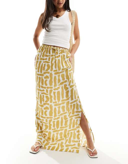ASOS DESIGN - Jupe mi-longue nouée à la taille avec imprimé tortillons - Moutarde