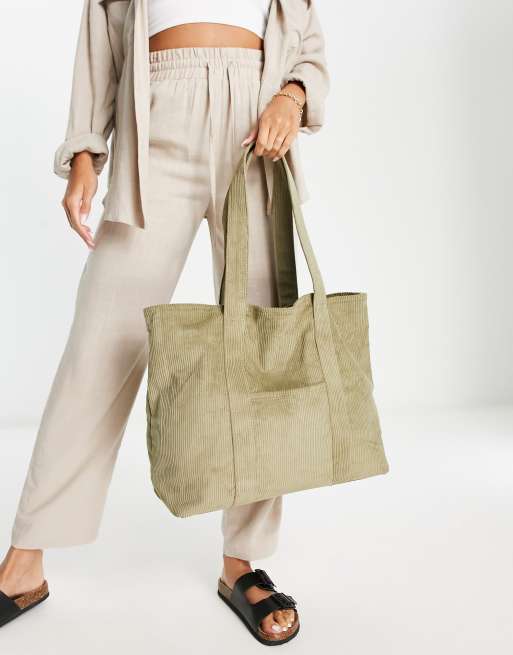 ASOS DESIGN – Kakifärgad toteväska i manchester med centrerad ficka