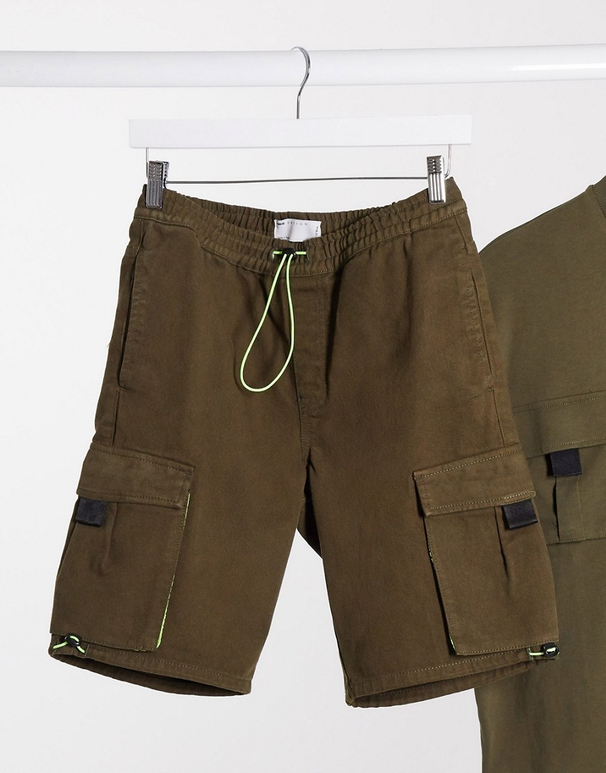 ASOS DESIGN - Kakifärgade jeansshorts med detaljer i mesh och tech - del av set-Grön