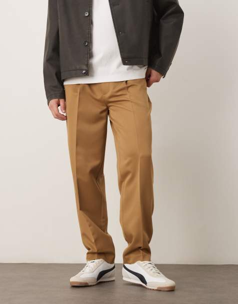 ASOS DESIGN – Kamelbruna, avsmalnande finbyxor i oversize med veck framtill - view 1