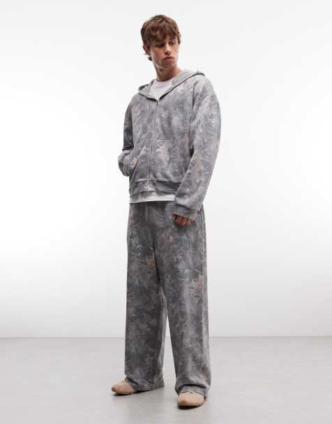 ASOS DESIGN – Kamouflagemönstrat, tvättat set i oversized fit med superbaggy mjukisbyxor och boxig tröja med dragkedja - view 1