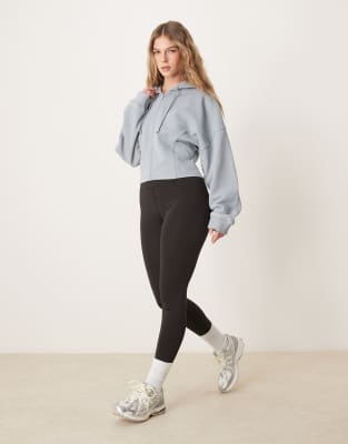 ASOS DESIGN - Kapuzenpullover in verwaschenem Blau mit Ziernähten und durchgehendem Reißverschluss