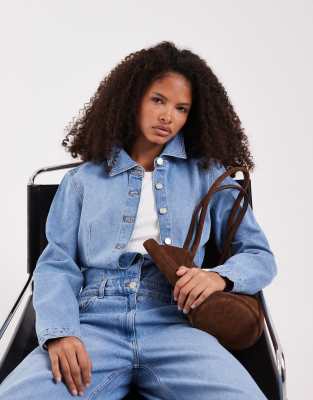 ASOS DESIGN - Kastig geschnittener Jeans-Jumpsuit in Mittelblau