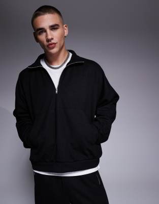 ASOS DESIGN – Kastiger Oversize-Kapuzenpullover in Schwarz mit Stehkragen, Reißverschluss und überschnittenen Schultern, Kombiteil - view 1