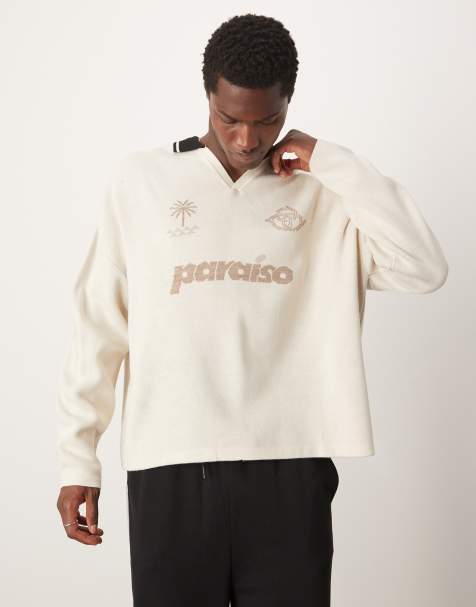 ASOS DESIGN – Kastiger Oversize-Strickpullover mit überschnittenen Schultern und Sport-Print auf der Brust - view 1