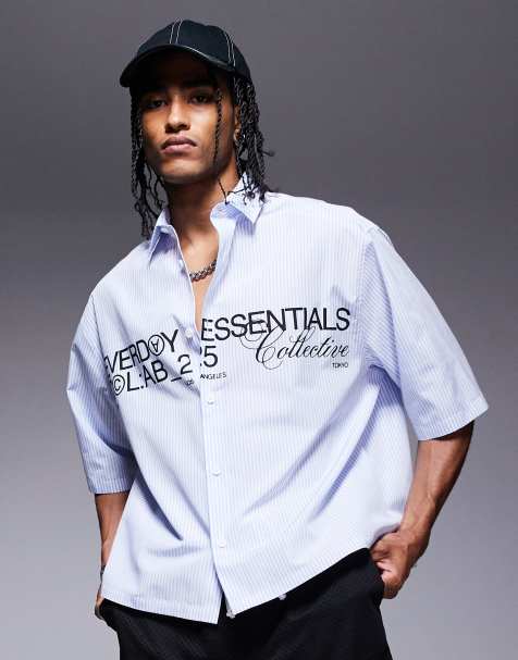 ASOS DESIGN – Kastiges Oversize-Hemd aus Popeline in Marineblau mit Grafikprint - view 1
