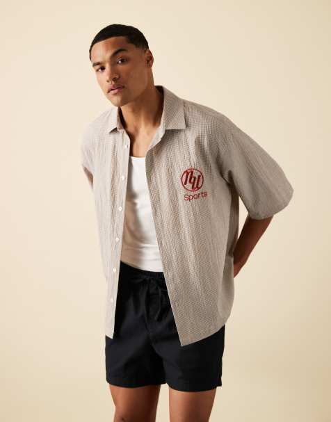 ASOS DESIGN – Kastiges Oversize-Hemd in Braun kariert mit Stickerei auf der Brust - view 1