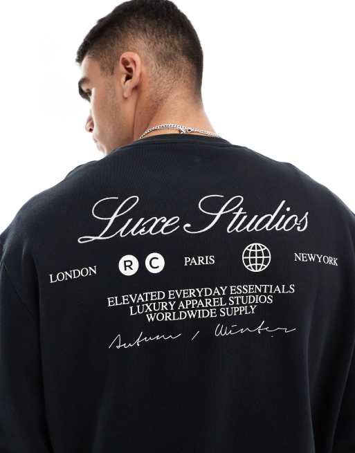 ASOS DESIGN – Kastiges Oversize-Sweatshirt in Schwarz mit „Luxe Studios“-Print