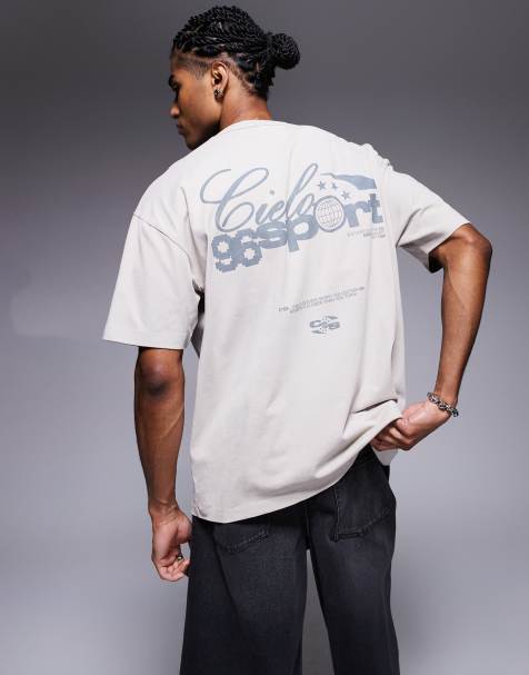 ASOS DESIGN – Kastiges Oversize-T-Shirt aus 220 g/m² schwerem Material in verwaschenem Beige mit Sports-Textgrafik - view 1