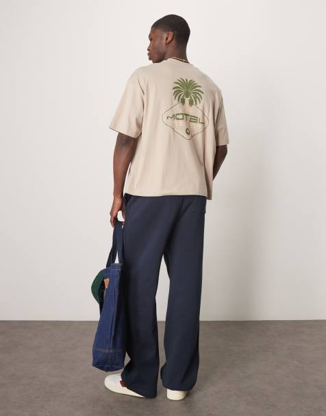 ASOS DESIGN – Kastiges Oversize-T-Shirt in Beige mit Palmen-Grafikprint - view 1