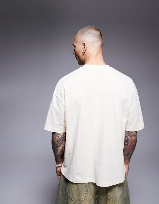 ASOS DESIGN – Kastiges Oversize-T-Shirt in Buttermilchgelb mit plastischer Textgrafik , 2 von 4