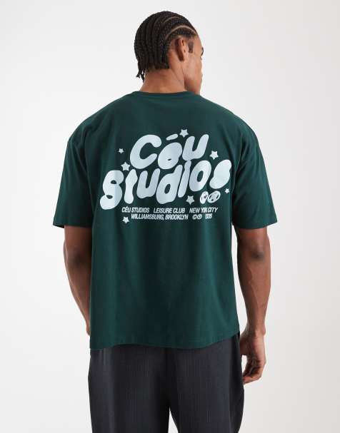 ASOS DESIGN – Kastiges Oversize-T-Shirt in Dunkelgrün mit Studios-Print - view 1