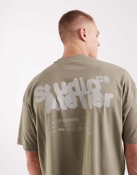 ASOS DESIGN – Kastiges Oversize-T-Shirt in Grün meliert mit Bubble-Textprint - view 1