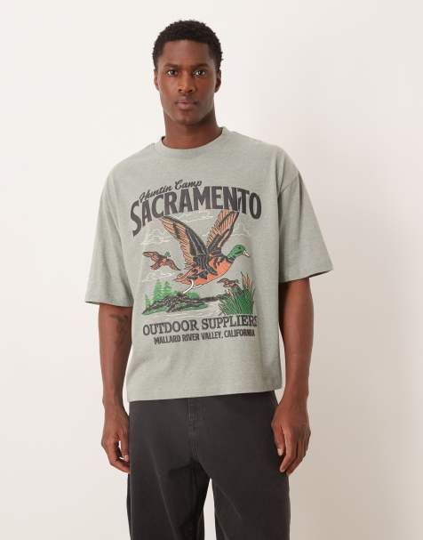 ASOS DESIGN – Kastiges Oversize-T-Shirt in meliertem Grün mit Enten-Schaumprint - view 1