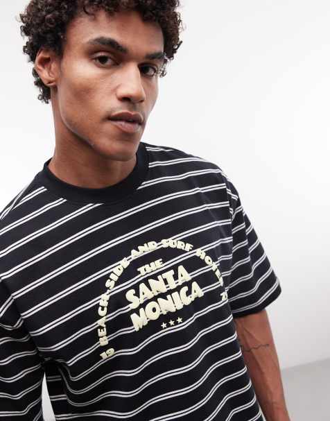 ASOS DESIGN – Kastiges Oversize-T-Shirt in Schwarz gestreift mit Schaumdruck-Schriftzug - view 1