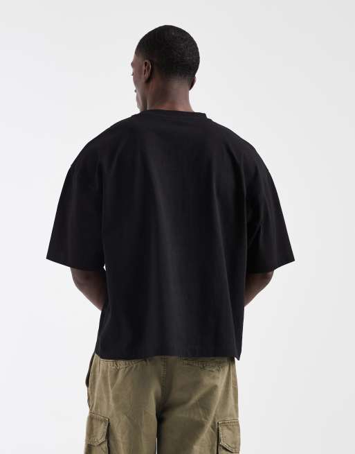 ASOS DESIGN – Kastiges Oversize-T-Shirt in Schwarz mit Fußball-Print in Bubble-Optik, 3 von 5