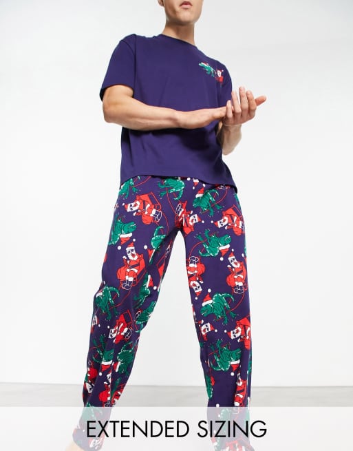 ASOS DESIGN - Kerstmis - Pyjamaset van T-shirt en broek in marineblauw met kerstdinosaurusprint