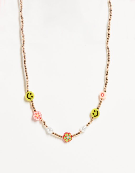 ASOS DESIGN - Ketting met bloemen en smilies in goudkleur