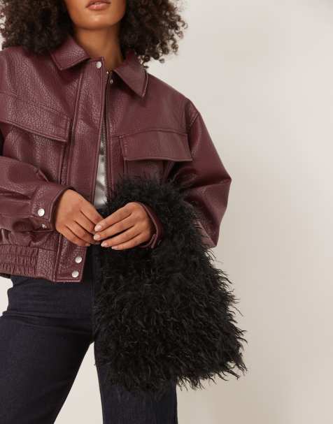 ASOS DESIGN – Kleine Tragetasche aus gekräuseltem Kunstpelz in Schwarz - view 1