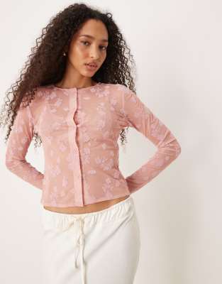 ASOS DESIGN - Knapp geschnittene Strickjacke in Rosa mit beflocktem Design
