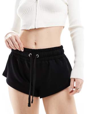 ASOS DESIGN - Knappe Jersey-Shorts in meliertem Schwarz