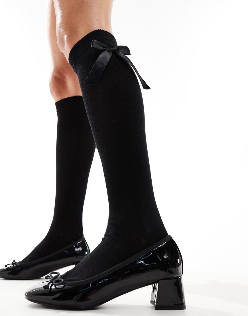 ASOS DESIGN knee high socks with bow in black