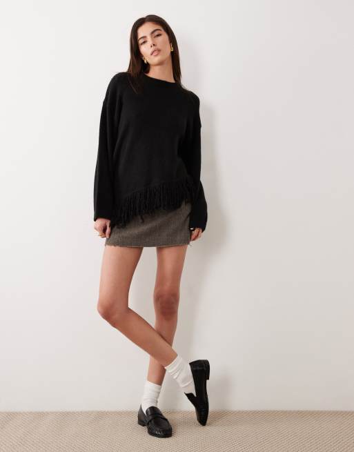 ASOS DESIGN knit asymmetrical hem sweater with fringe in black | ASOS