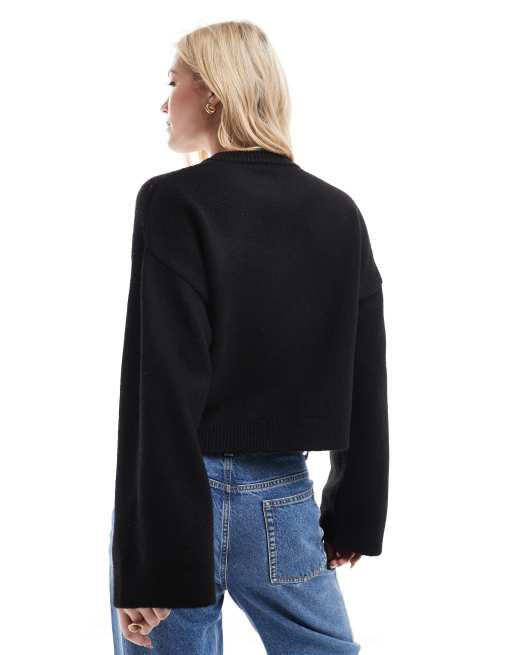 ASOS DESIGN knit cardigan with contrast flower corsages in black