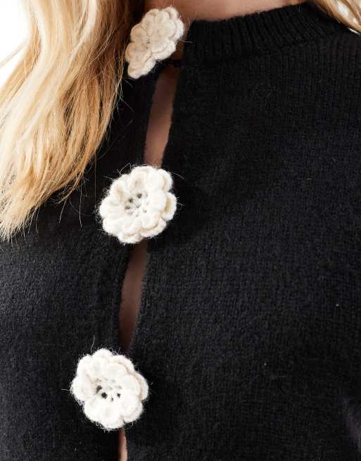 ASOS DESIGN knit cardigan with contrast flower corsages in black