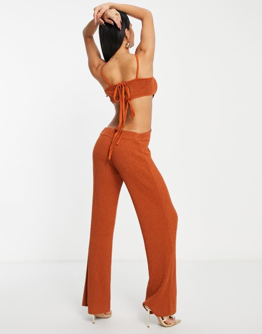 ASOS DESIGN knit festival jumpsuit with cut out details in brown