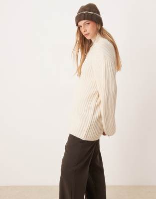 knit funnel neck sweater with structured sleeve in cream-White