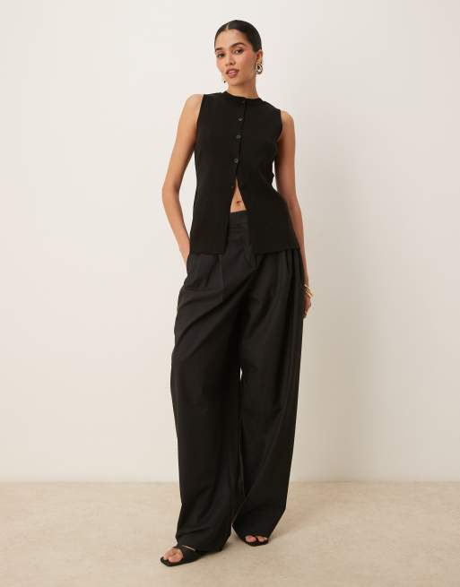 ASOS DESIGN knitted crew neck waistcoat with front split in black