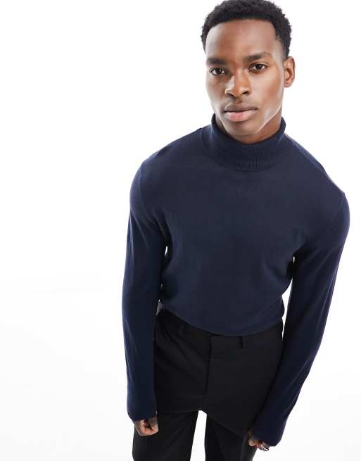 ASOS DESIGN knitted cotton roll neck jumper in navy ASOS