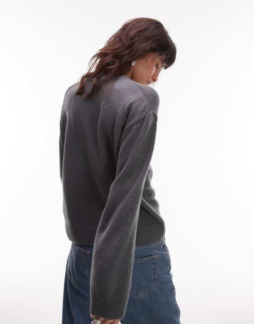 ASOS DESIGN knitted crew neck jumper with silver metal detail in charcoal