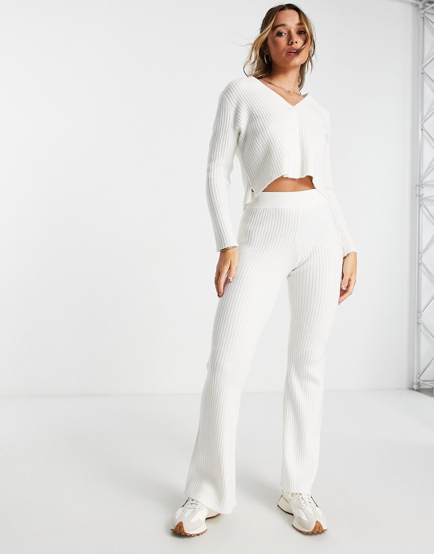 ASOS DESIGN knitted flare pants in cream-White