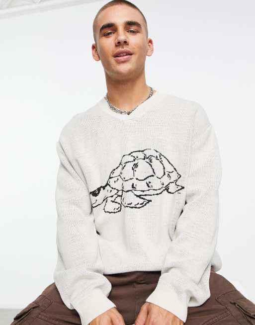 ASOS DESIGN knitted jumper with all over turtle print in beige